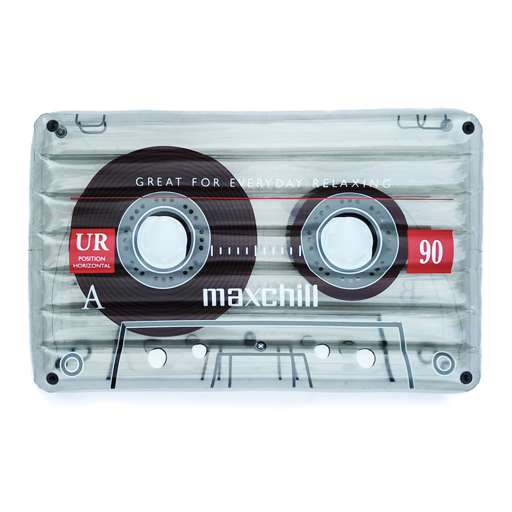 Detailed photo of the clear cassette tape float in front of a white background. The float has the words "Great for everyday relaxing" and the mimicked logo of "Maxchill."